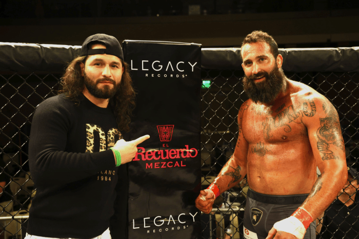 Jorge Masvidal, CEO of Gamebred Fighting, in a cage sponsored by Legacy Records 